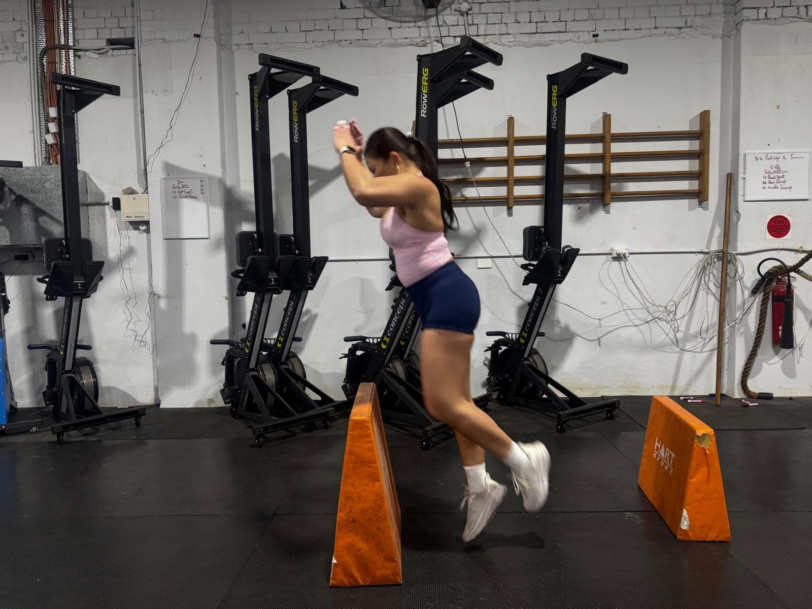 A member jumping over a hurdle wedge