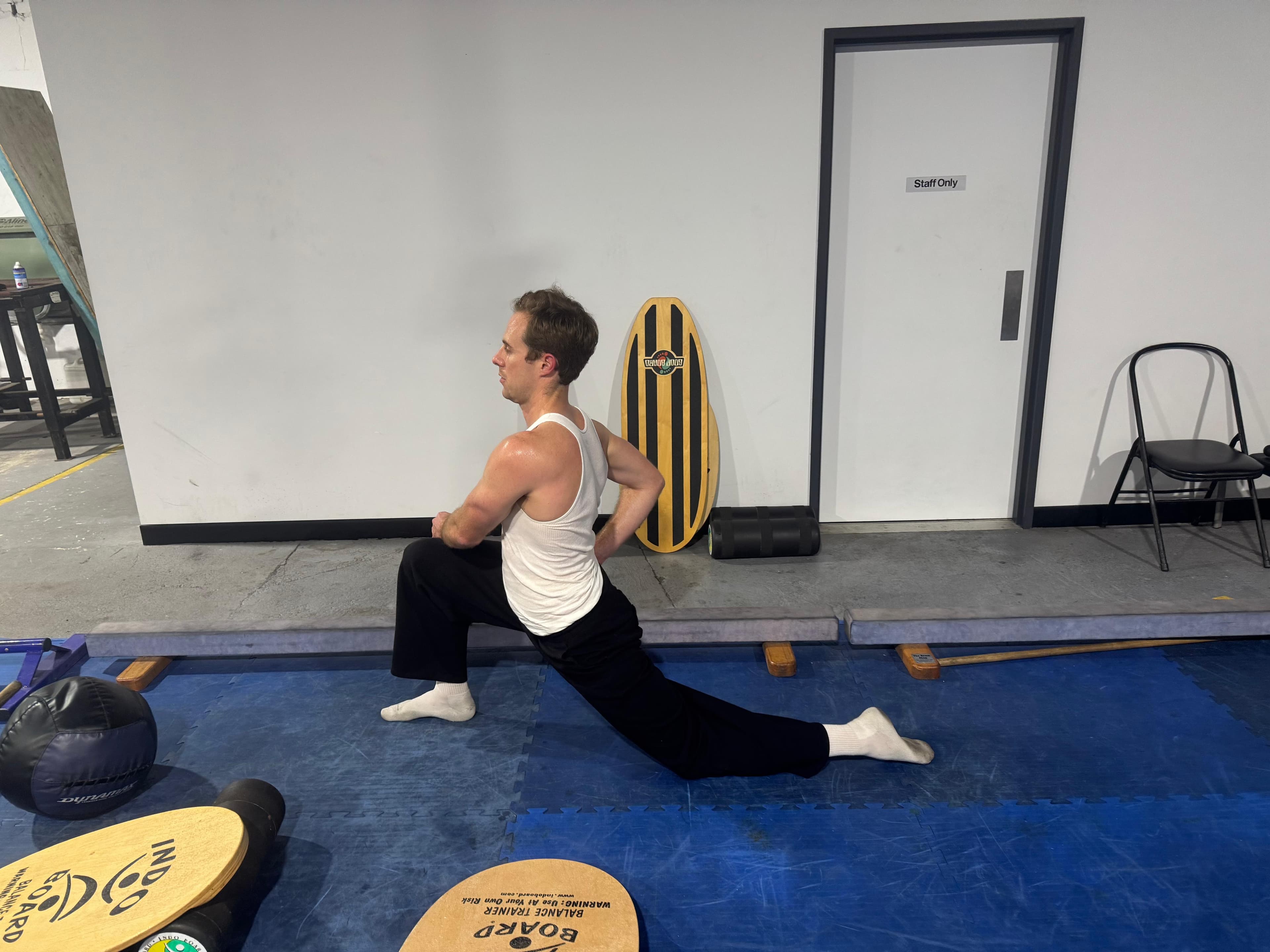 A member stretching near the gym floor